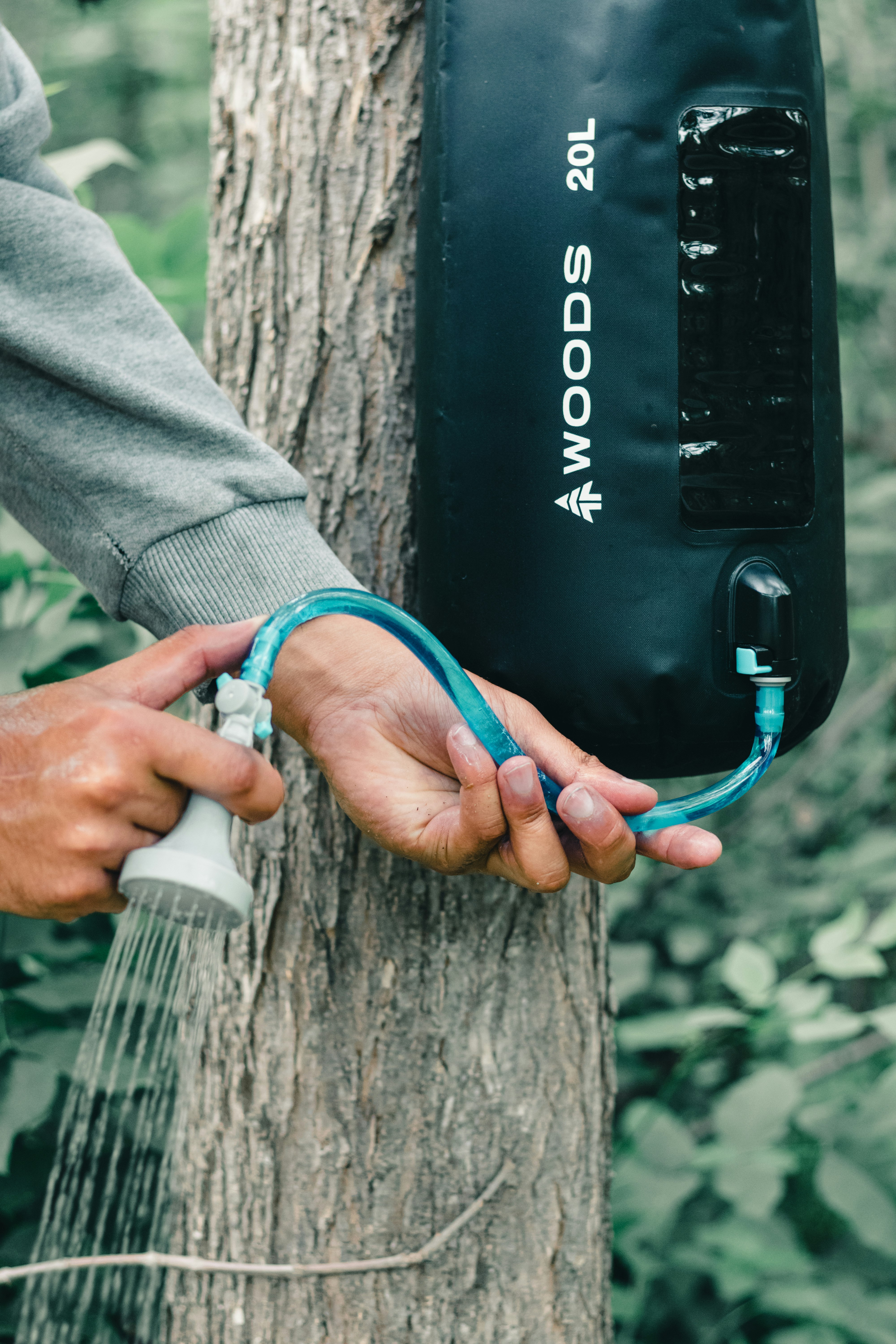 person holding black and blue corded device